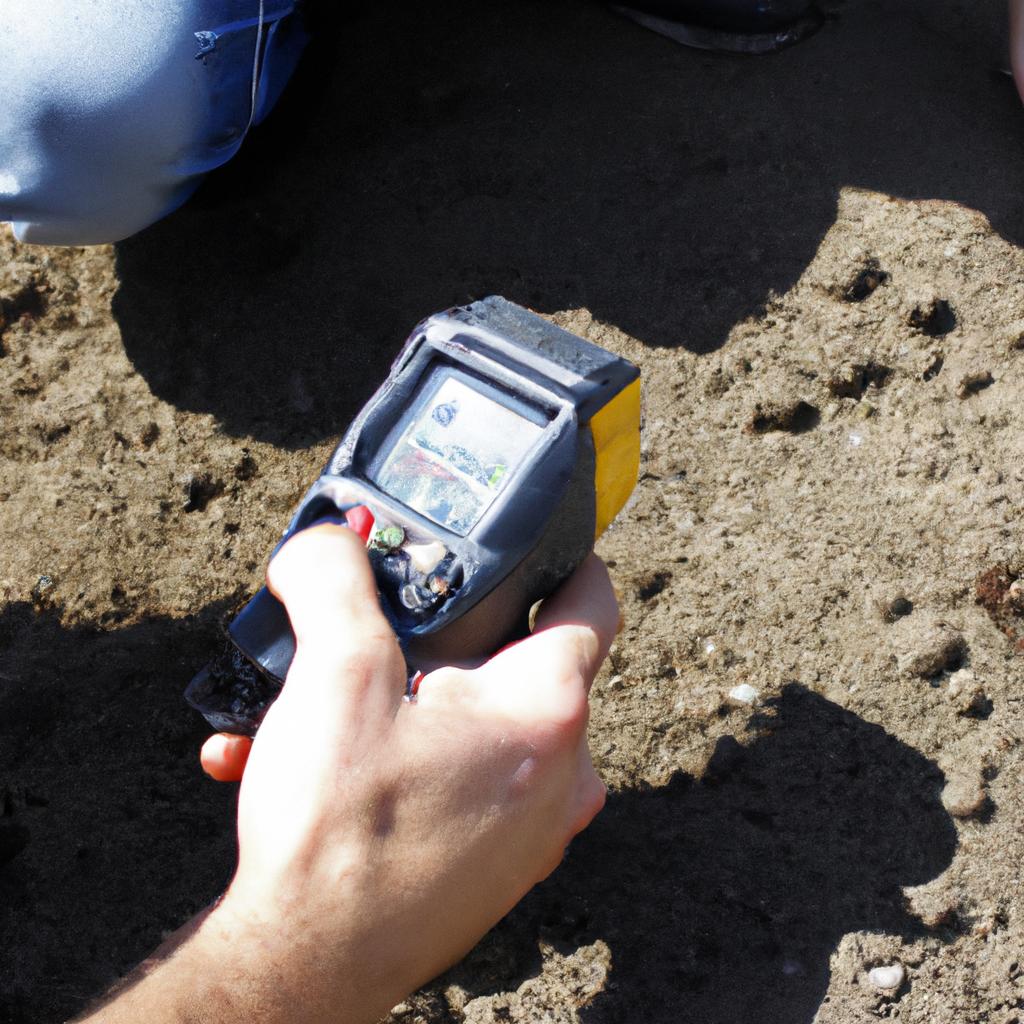 Person using soil testing equipment
